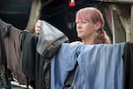 Jaime Smith hangs laundry from her trailer in Clackamas County on Sept. 6, 2024. Like other people living outside, she's struggled to stay cool during multiple heatwaves.