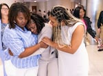 Pamela Dias (center), Ajike “A.J.” Owens' mother, is consoled by friends and family outside the courtroom after a jury found Susan Lorincz guilty of manslaughter in the shooting death of her daughter, Friday afternoon in Ocala, Fla. 