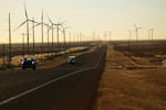 Wind turbines along a highway in Andrews, Texas.