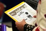 FILE - A job seeker waits to talk to a recruiter at a job fair Aug. 28, 2025, in Sunrise, Fla.