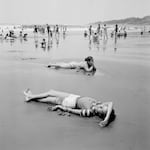 Families congregate on the Pacific coast beach in La Libertad, El Salvador, April 1983.