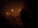 Qemtsna faces her enemy at the end of the world. Abrahamson filmed the scene around three in the morning. Abrahamson is on camera while producer Mike Kane holds a torch inside the Manresa Grotto Cave.
