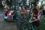 Participants check their bicycles before taking off. The World Naked Bike Ride is a protest against fossil fuel dependency, for bike safety and for body positivity.