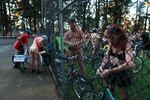 Participants check their bicycles before taking off. The World Naked Bike Ride is a protest against fossil fuel dependency, for bike safety and for body positivity.