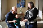 Whitney and Brittany Young play with their son Hazen. Using 'preimplantation genetic diagnosis' they made sure he doesn't carry the family's BRCA gene mutation and its increased risk for cancer. 