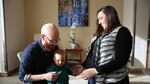 Whitney and Brittany Young play with their son Hazen. Using 'preimplantation genetic diagnosis' they made sure he doesn't carry the family's BRCA gene mutation and its increased risk for cancer.