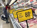 A customer shops for meat at a Safeway store in San Rafael, Calif., on April 12, 2023.