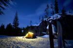 A busy road in summer becomes an isolated wilderness camp in winter.