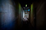 A mortuary worker transports the body of a COVID-19 victim on a stretcher at the morgue of a hospital in Barcelona, Spain, Thursday, Nov. 5, 2020. After successfully bringing the daily death count down from over 900 in March to single digits by July, Spain has seen a steady uptick that brought deaths back to over 200 a day this month. With that relapse, the body collectors have returned to making the rounds of hospitals, homes and care facilities.