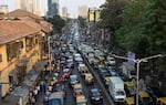 Lanes of traffic are packed with vehicles on a bridge in India.