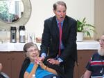 Democratic Sen. Ron Wyden talks to residents of  Laurelhurst Village Assisted Living in Portland about cuts in the new Republican health care bill.