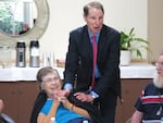 Democratic Sen. Ron Wyden talks to residents of Laurelhurst Village Assisted Living in Portland about cuts in the new Republican health care bill.