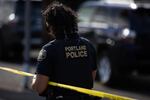 Police respond to a person believed to be armed barricaded inside a home in the Sellwood neighborhood of Portland, Ore., Sunday, June 28, 2020.