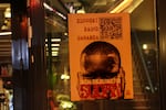 A poster advertises a fundraiser for Radio Dabanga, a station dedicated to news from Sudan, on a restaurant window in Amsterdam on Oct. 22.