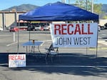 One of the booths set up by signature gatherers for the John West recall campaign, Oct. 10, 2024.