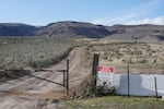 FILE - An "Access Restricted" sign is displayed at the Lithium Nevada Corp. mine site at Thacker Pass on April 24, 2023, near Orovada, Nev. Federal wildlife officials have agreed to conduct a full, year-long review to determine whether a tiny snail found only in high-desert springs near a huge lithium mine being built along the Nevada-Oregon line should be listed as a threatened or endangered species. The U.S. Fish and Wildlife Service said in a finding published in the Federal Register on Thursday, Feb. 8, 2024 enough scientific exits to warrant the review sought by environmentalists who say that groundwater pumping required for the operation of the Thacker Pass mine could push the Kings River pyrg to the brink of extinction.