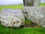 The Altar Stone, seen here underneath two bigger Sarsen stones.