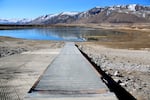 Water levels at a reservoir over Ana Springs shrink in the winter, as groundwater flowing from the springs is released to a river channel feeding Summer Lake State Wildlife Area. Feb. 18, 2022.