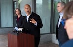 Sen. Cory Booker, D-N.J., speaks during a press conference in Portland, Ore., April 7, 2026, along with Rep. Maxine Dexter, D-Ore., left, and Sen. Jeff Merkley, D-Ore.