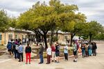 A line forms outside of the Ruiz Branch of the Austin Public Library to vote in Austin, Texas.