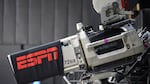 A television camera is viewed during an ESPN broadcast of a WNBA basketball game between the Connecticut Sun and the Minnesota Lynx on July 26, 2020, in Bradenton, Fla. ESPN is launching a new streaming service at $29.99 per month.
