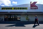 A woman leaves a Kmart in Avenel, N.J., Monday, April 4, 2022. When the New Jersey store closes its doors on April 16, it will leave only three remaining U.S. locations for the former retail powerhouse. It's a far cry from the chain's heyday in the 1980s and ‘90s when it had more than 2,000 stores and sold product lines endorsed by Martha Stewart and former “Charlie's Angel” Jaclyn Smith.  (AP Photo/Seth Wenig)