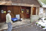 Stuart Wells surveys the flood damage at the conservation groups' wildlife care center. March 1, 2023