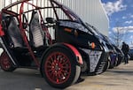Arcimoto's FUVs, on display outside a production facility in Eugene.