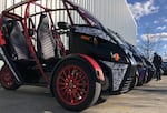 Arcimoto's FUVs on display outside a production facility in Eugene in February 2022.