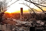 Sunday, Jan. 12: The sun rises behind a home destroyed by the Palisades Fire in the Pacific Palisades community of Los Angeles.