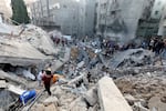 Palestinians search the destroyed annex of the Church of Saint Porphyrius, damaged in a strike on Gaza City on Oct. 20.