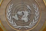 FILE - The United Nations logo is seen inside the 79th session of the United Nations General Assembly, Tuesday, Sept. 24, 2024.