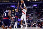 Portland Trail Blazers guard Anfernee Simons (1) shoots against Los Angeles Clippers guard Terance Mann (14) during the first half of an NBA basketball game, Wednesday, Oct. 30, 2024, in Inglewood, Calif. (AP Photo/Ryan Sun)