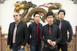 The Slants (left to right: Joe X Jiang, Ken Shima, Tyler Chen, Simon "Young" Tam, Joe X Jiang). The band has toured and released several albums as the trademark dispute has unfolded.