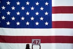 A supporter holds a sign as Republican presidential nominee former President Donald Trump speaks at a town hall at Lancaster County Convention Center, Sunday, Oct. 20, 2024, in Lancaster, Pa. (AP Photo/Evan Vucci)