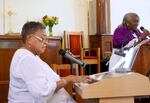 Phillis Whitmore (left) plays music during Sunday services at First A.M.E. Zion Church in Portland, Ore. She has played music since she was a child and has attended this church her entire life.