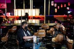 Jeff Cantrell waits at Larry Flint's Hustler Club strip club after getting his second dose of coronavirus vaccine Friday, May 21, 2021, in Las Vegas. Las Vegas officials held a pop-up vaccine clinic at the strip club.