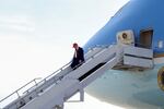 President Trump walks off Air Force One on April 29 at Selfridge Air National Guard Base, Michigan. Qatar has offered to replace Air Force One with a luxury Boeing 747 jet.