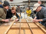 Volunteers apply restoration skills in hands-on workshops in efforts to repair the High Rock Lookout. The windows, first installed in the lookout in 1931, were reinstalled by volunteers in 2025. In June, 2026, they were destroyed by vandals.