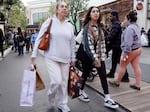 A person carries shopping bags at a shopping center on the day after Christmas on Dec. 26, 2023 in Glendale, Calif. Strong consumer spending helped drive better-than-expected economic growth in the final months of 2023.