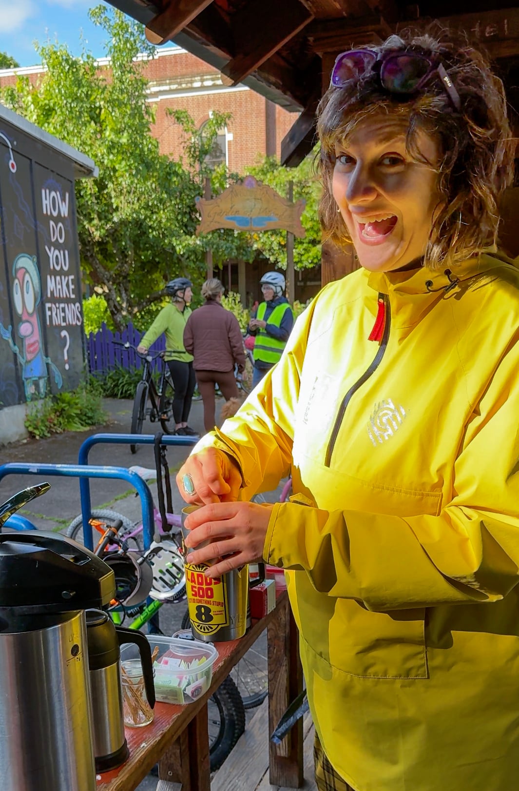 Lauren McCune gets some coffee after leading a group bike ride to Abernethy Elementary on May 21, 2025. McCune is one of the parent volunteers who power the