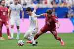 Portugal's Francisco Conceicao, right, vies for the ball with Uzbekistan's Khojiakbar Alijonov during the World Cup Group K soccer match between Portugal and Uzbekistan in Houston, Tuesday, June 23, 2026.