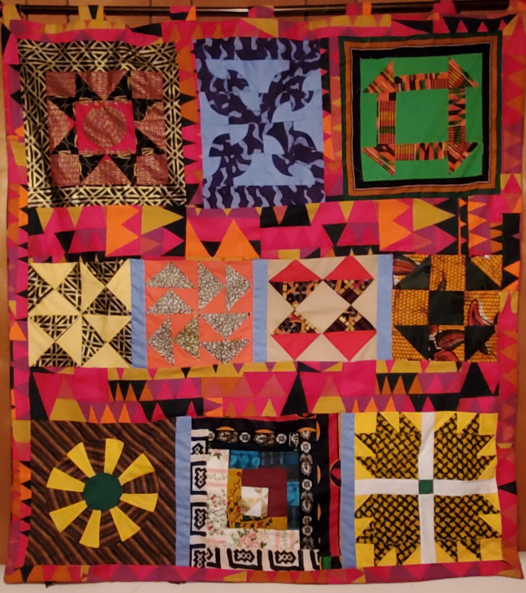 A completed Underground Railroad Code quilt made by Edith Edmunds. The top right block represents the