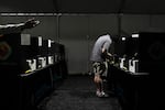 A voter casts a ballot at a vote center set up in a tent in Las Vegas on June 9.