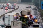 Investigations continue on northbound Interstate 5 in North Portland, where police shot and killed one person during an alleged carjacking Monday morning, Dec. 6, 2021. Officials say that the alleged carjacker was being pursued driving the wrong way on the interstate, crashed, and attempted to carjack another vehicle, firing a shot and injuring one woman.