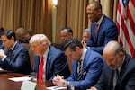 Housing and Urban Development Secretary Scott Turner prays during a Cabinet meeting with President Donald Trump at the White House in Washington on Feb. 26, 2025, as Secretary of State Marco Rubio and Defense Secretary Pete Hegseth and Commerce Secretary Howard Lutnick also bow their heads.