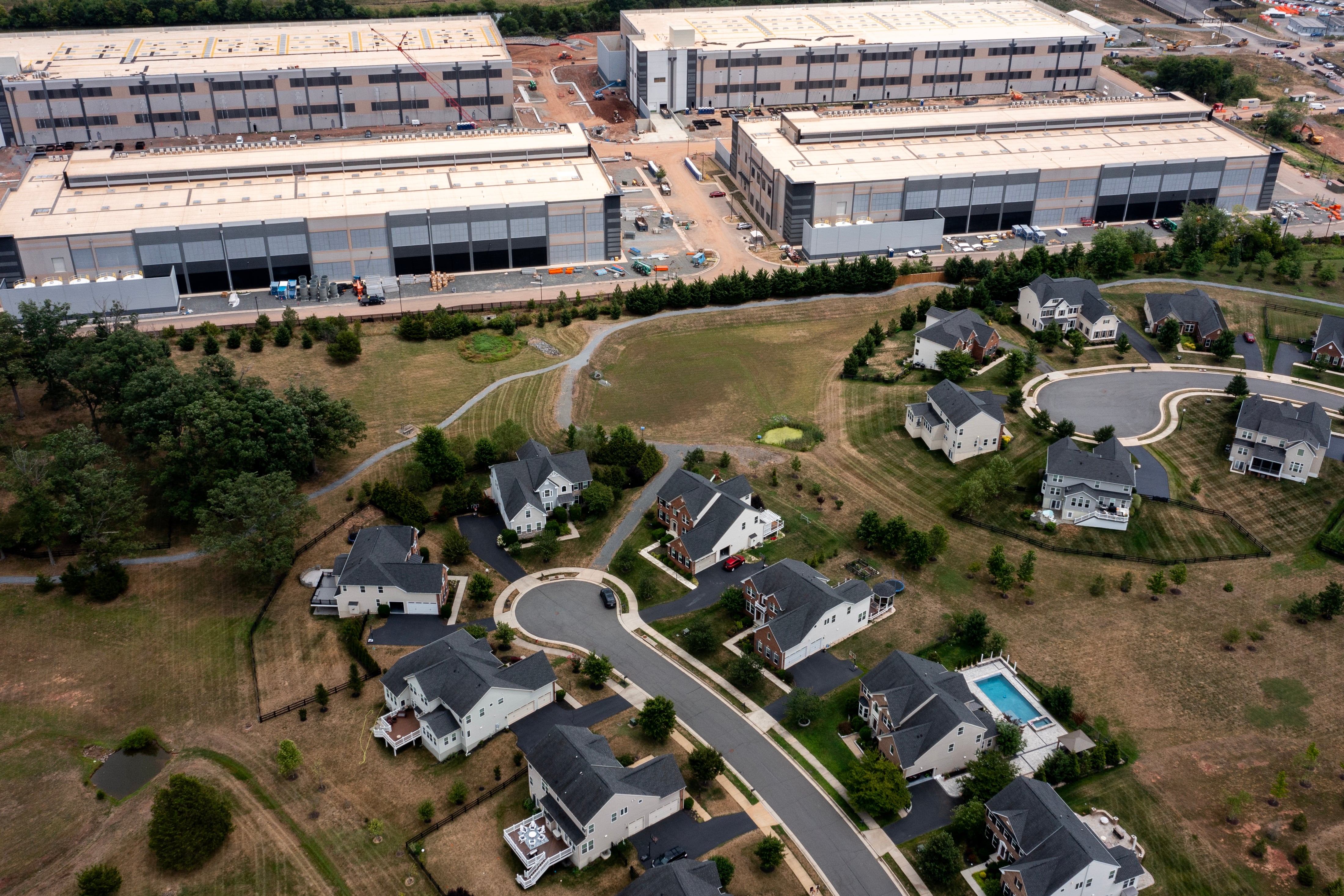 An Amazon Web Services data center is shown situated near single-family homes in Stone Ridge, Va.
