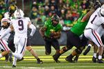 Oregon running back CJ Verdell (7) runs through hole in during the fourth quarter of an NCAA college football game Saturday, Sept. 25, 2021, in Eugene, Ore.