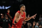 Portland Trail Blazers forward Toumani Camara reacts after shooting a 3-pointer during the first half of an NBA basketball game against the Washington Wizards, Sunday, March 29, 2026, in Portland.