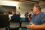 Wes Curtiss speaks to company representatives at a Pacific Power town hall meeting about recent power outages in Madras, Ore., on June 25, 2026.